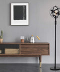 Globe Industrial Floor Lamp With Dimmable On Off Switch next to wooden console in living room setting.