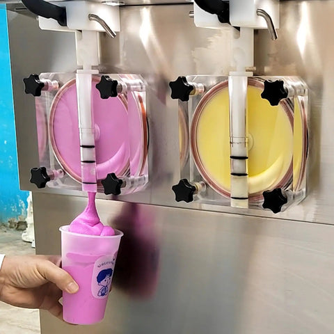 Commercial Dual Tank Ice Slush Machine For Top Shelf Margaritas And Creamy Milkshakes With Smart Freeze Tech pouring pink slush.