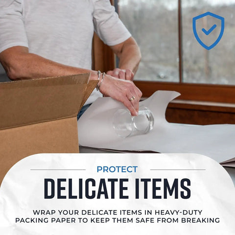 Person wrapping glassware in Newsprint Packing Paper Sheets For Moving 160 Sheets 27 By 17 Inches 5 Pound Pack in room