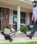 Man using 20 Inch Premium Push Spike Aerator With 3D Galvanized Steel Tines And Weight Tray For Deep Core Penetration on lawn.