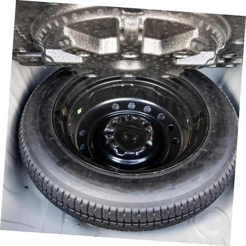 Heavy Duty Spare Tire Bolt Hold Down Retainer For Quick Install Fits Most Vehicles And Keeps Your Spare Wheel From Bouncing Or Shifting In The Trunk Built Tough With Durable Steel And Corrosion Resistant Finish For Everyday Driving shown securing tire in vehicle trunk