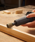 Heavy Duty Workhorse Die Grinder With Variable Speed 7000 To 30000 Rpm in use against wood, showcasing rust removal and grinding.