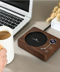 Game Changing Desk Essential Smart Electric Coffee Heated Coaster With Precise Thermostatic Heat Control Adjustable From Forty To Seventy Five Degrees on a workspace.
