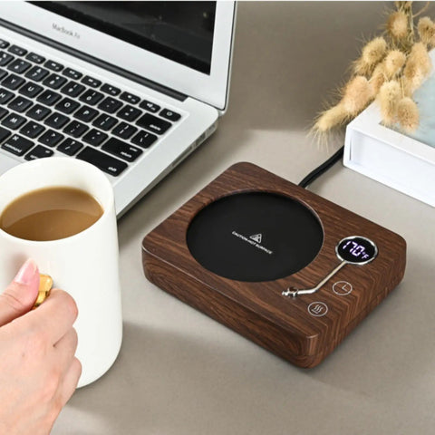 Game Changing Desk Essential Smart Electric Coffee Heated Coaster With Precise Thermostatic Heat Control Adjustable From Forty To Seventy Five Degrees on a workspace.