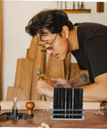 Man using Pro Grade Cylindrical Punch Transfer Punch Tools Set With Base Design for accurate marking on wood in workshop