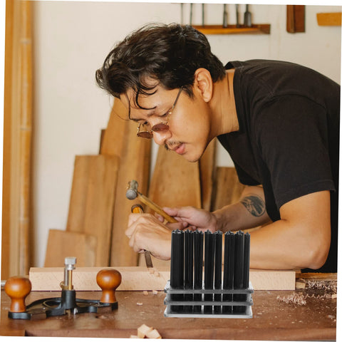 Man using Pro Grade Cylindrical Punch Transfer Punch Tools Set With Base Design for accurate marking on wood in workshop