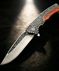 Retro Floral Engraved Folding Pocket Knife With Wood Inlay Handle And Ball Bearing Action Lightweight EDC Knife for men on dark background