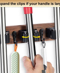 Close-up of Wall Mount Broom And Mop Holder With Five Slots And Four Hooks Easy Install Space Saving Rustic Wood Tool Organizer Rack