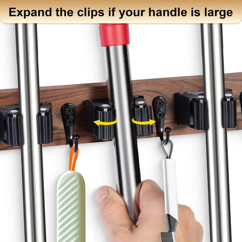Close-up of Wall Mount Broom And Mop Holder With Five Slots And Four Hooks Easy Install Space Saving Rustic Wood Tool Organizer Rack