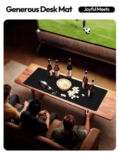 Boss Level PU Leather Desk Protector With Non Slip Grip And Waterproof Surface Sweet Wrist Rest For Smooth Mouse Slide And Kickass Desk Coverage At Home Or Office on a coffee table with drinks and snacks.