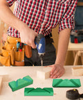 Rock Solid Drill Bit Sharpening Jig Kit Three Piece 3D Printed Bench Grinder Guide in use with a cordless drill on wood.
