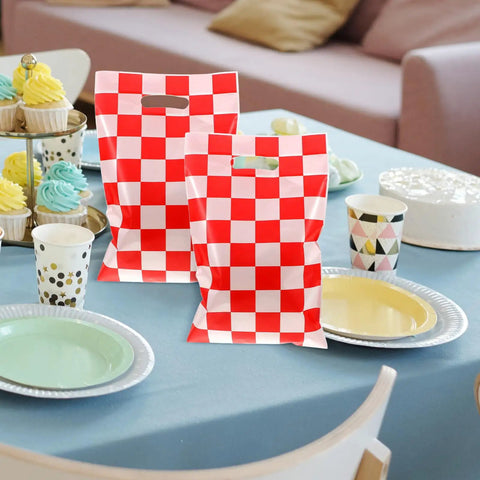 Race Car Themed Gift Bags With Handle Pack Of 50 Portable Lightweight Plastic Candy Bags on a table setting, checkered pattern.