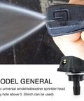 Close-up of front windshield washer nozzles kit spraying water, 0.31 inch sprayer head, universal black replacement for cars and trucks