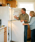 Couple inspecting fridge door hinge after installing Fridge Door Hinge Shaft Replacement Kit For Refrigerator Doors Easy Install No Tools Needed DIY Friendly Smooth Opening And Closing For Home Kitchen Apartment Hotel Restaurant Farmhouse