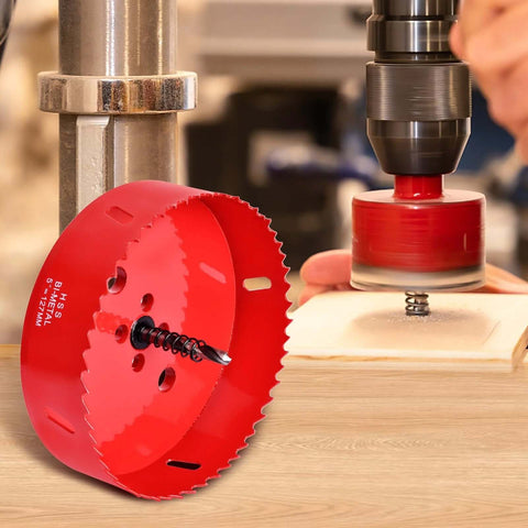 4-inch red HSS bi-metal hole saw with pilot bit, shown with a drill on a wood surface