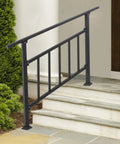 Heavy Duty 4 Step Stair Rail With Integrated Safety Fence And Rock Solid Steel Handrail For Outdoor Indoor Stairs Built Tough Against Rust Formation With Wide Base Mounting Plate For Easy Weekend Install installed on outdoor steps with greenery.