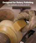 Hand using Straight Up Pure Carnauba Wax Bar for Wood Finishing on rotary polishing machine for a smooth finish.