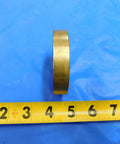 Top Shelf 2 Inch 20 Thread Brass Ring Gauge Nut Spacer For Precision Calibration And Machine Shop Work Built Sick Tight With Smooth Finishes For Heavy Duty Tasks Real Deal Engineering MH3938LVR on blue background with measuring tape.
