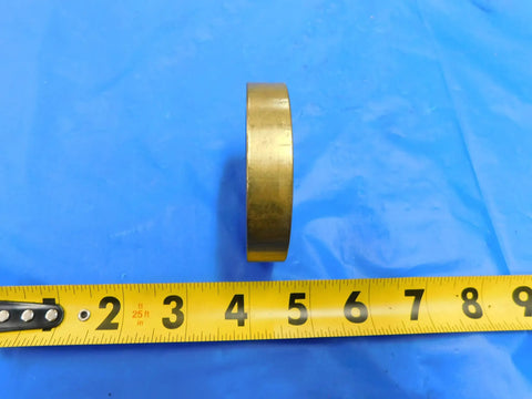 Top Shelf 2 Inch 20 Thread Brass Ring Gauge Nut Spacer For Precision Calibration And Machine Shop Work Built Sick Tight With Smooth Finishes For Heavy Duty Tasks Real Deal Engineering MH3938LVR on blue background with measuring tape.