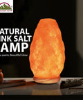 Himalayan Glow Natural Pink Salt Lamp Hand Mined In The Himalayan Mountains Crystal Night Light With ETL Brightness Dimmer Switch Wooden Base 6 To 8 Lbs Salt Lamp Calming Amber Glow Gift Box Included glowing on tabletop