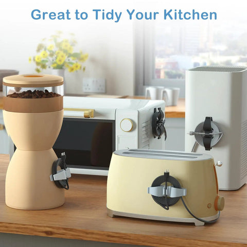 Upgraded Cord Organizer For Appliances Eight Pack Stick On Cable And Wire Organizer attached to kitchen appliances.