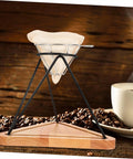 Heavy Duty Reusable Stainless Steel Coffee Filter Holder With Secure Drip Rack And Premium Filter Cloth Set For A Smooth Daily Grind Setup At Home Or Office on wooden base with coffee beans.