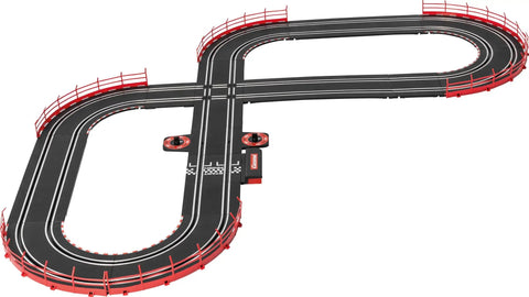 Electric Powered Slot Car Racing Set With 2 Hand Controllers And 2 Cars In 1 To 43 Scale For Kids Featuring NASCAR Watkins Glen Duel On A Realistic Track layout with red barriers