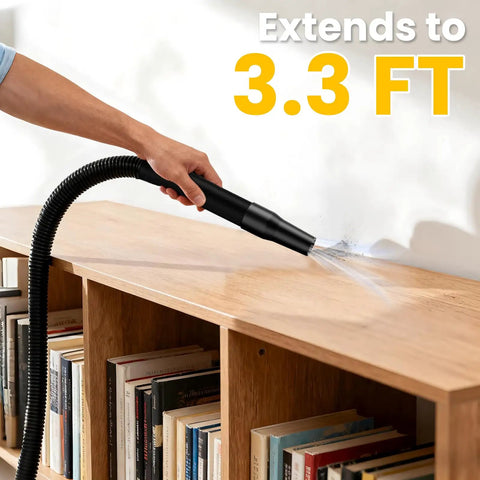 Hand using the Straight Up Powerhouse Lightweight Cordless Handheld Vacuum with a 3.3 ft extension on wooden shelf.