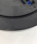 Hydra Fitness Exchange magnetic brake flywheel; black circular plate with blue connector.