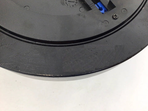 Hydra Fitness Exchange magnetic brake flywheel; black circular plate with blue connector.