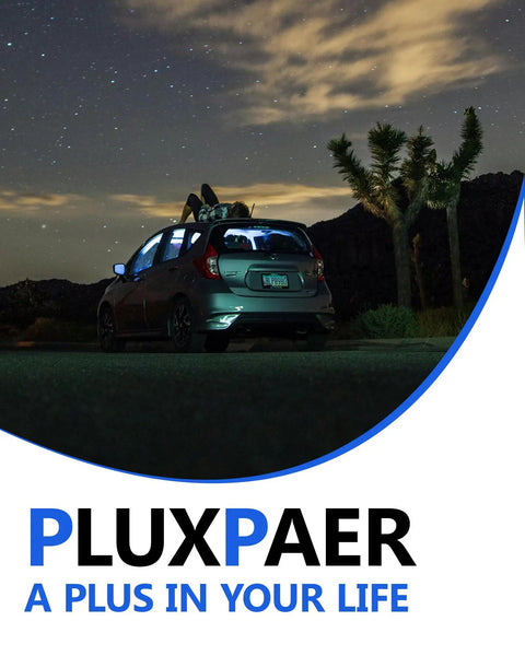 Car parked under night sky with rooftop luggage, desert landscape