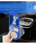 Close-up of countertop ice maker with handle delivering chewable nugget ice in six minutes or less, easy-to-use control panel.