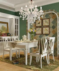 Dining room with Six Light Crystal Chandelier With K9 Clear Crystals, Modern Ceiling Pendant Lighting Fixture over table.