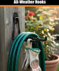 Tough As Nails Heavy Duty Garage Hooks holding a garden hose and gloves, wall mounted, PVC coated, black, on a wooden surface outdoors.