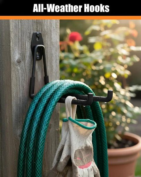 Tough As Nails Heavy Duty Garage Hooks holding a garden hose and gloves, wall mounted, PVC coated, black, on a wooden surface outdoors.
