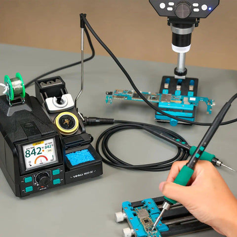 Hand using 200W Micro Soldering Kit with Pro Grade Precision Iron Station for PCB work, showing 11 tips and lead-free solder.