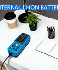 Pro Grade Surface Roughness Tester With Multi Parameter Profilometer For Metal Plastic Wood Finish Measurement Ra Rz Rq Rt Ry Rp Rv Rmax RSk RSm ISO ANSI DIN JIS Standards For Precise Surface Profiling In Industrial Apps. Blue handheld roughness tester on a desk