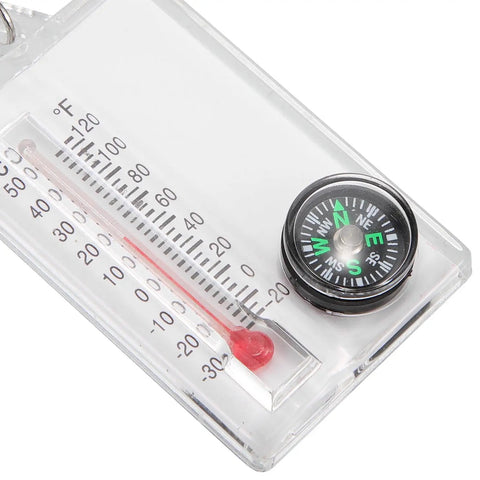 Close-up of Two Pack Portable Keychain Compass With Thermometer Wear Resistant Mini Pocket Navigator for hiking and outdoor use.