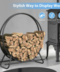 Heavy Duty Circular Firewood Rack 4 Foot Diameter Made From Black Steel Pipes for indoor and outdoor use showing logs