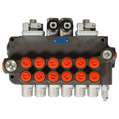 Front view of 6-spool hydraulic directional control valve block with orange port plugs