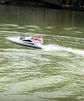 2.4G Wireless RC Speed Demon Racing Boat With Luxury Yacht Styling on a pond creating water trail