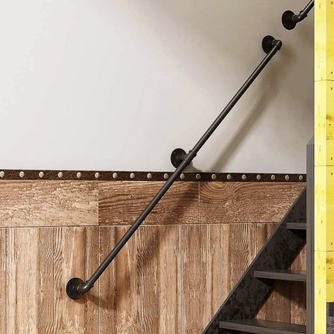 Adjustable Step Handrail For Indoor Outdoor Stairs, Heavy Duty Wrought Iron Wall Banister mounted on wall near wooden stairway.