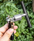Person holding Pro Bike Chain Tool For Six To Twelve Speed Chains, Chain Breaker with Storage Base, Hardened Steel HRC 47 49.