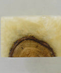 Close-up of a rectangular handmade wood resin cabinet knob, showing wood grain and smooth surface for sleek hold.