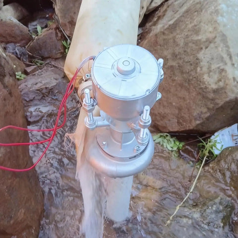 300W Micro Hydroelectric Generator For Off Grid Power Portable Water Turbine 50Hz 220V installed outdoors in a stream