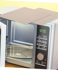 Heat Resistant Microwave Mica Sheet Set, 10 Pieces on top of an open microwave, showing waveguide cover installation.