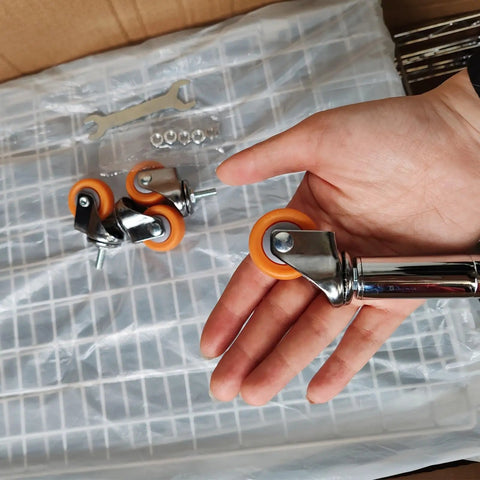Built Tough As Nails Yellow Nylon Swivel Caster Wheels Metric Threaded Stem showcased in hand for office chair upgrade.