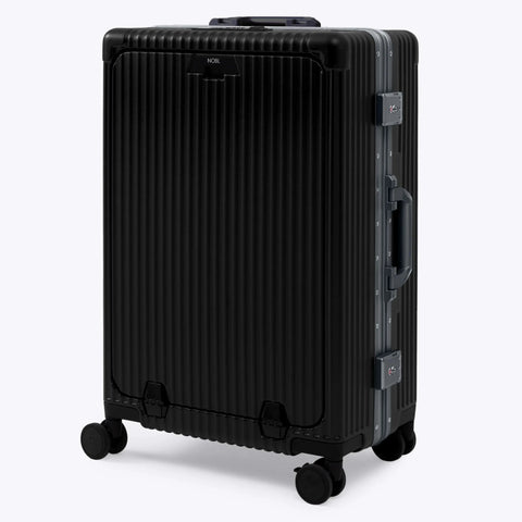 Nobl Travel zipperless check-in suitcase, front view, jet black with aluminum frame, TSA locks, 360° wheels