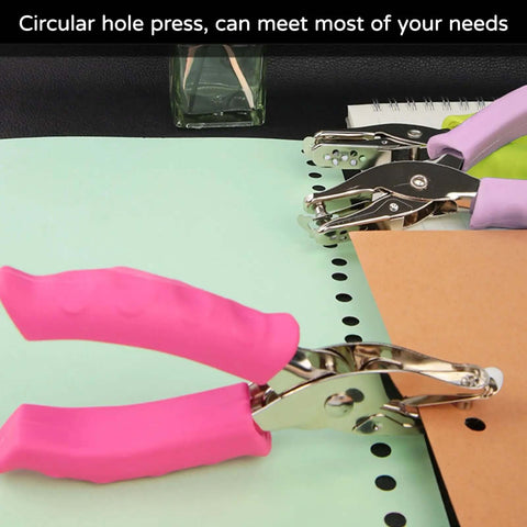 Two Pack One Quarter Inch Hole Punch For Paper Crafts Handheld Circle Punch with pink grip punching paper