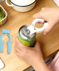 Using Six Pack Plastic Bottle Cap Opener Set 3 In 1 Gripper Tool For Arthritic Hands on a can, with spare opener on counter